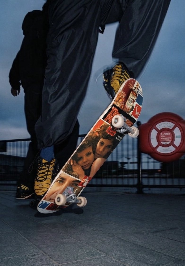 Skate deck mid-trick at dusk